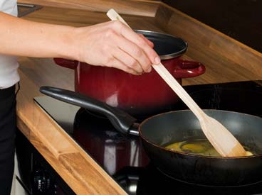 Women Cooking eggs for breakfast